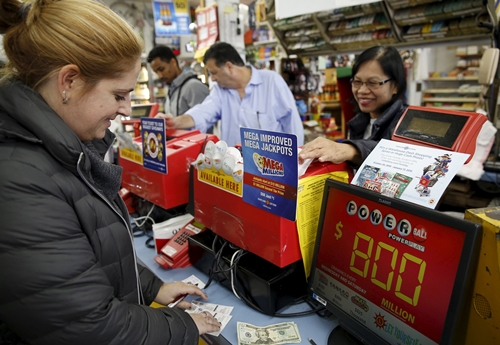 A customer purchases Powerball lottery tickets at Talbert's Ice & Beverage Service in Bethesda, Maryland